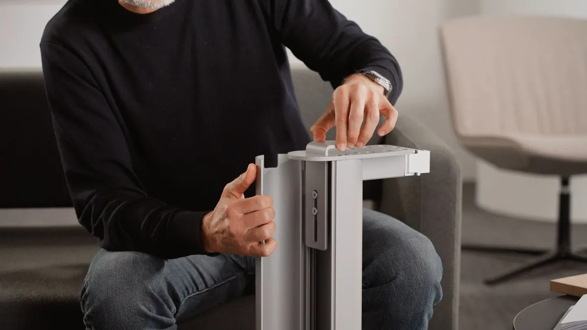Hands adjusting the aluminium leg of a DVO Anchor table