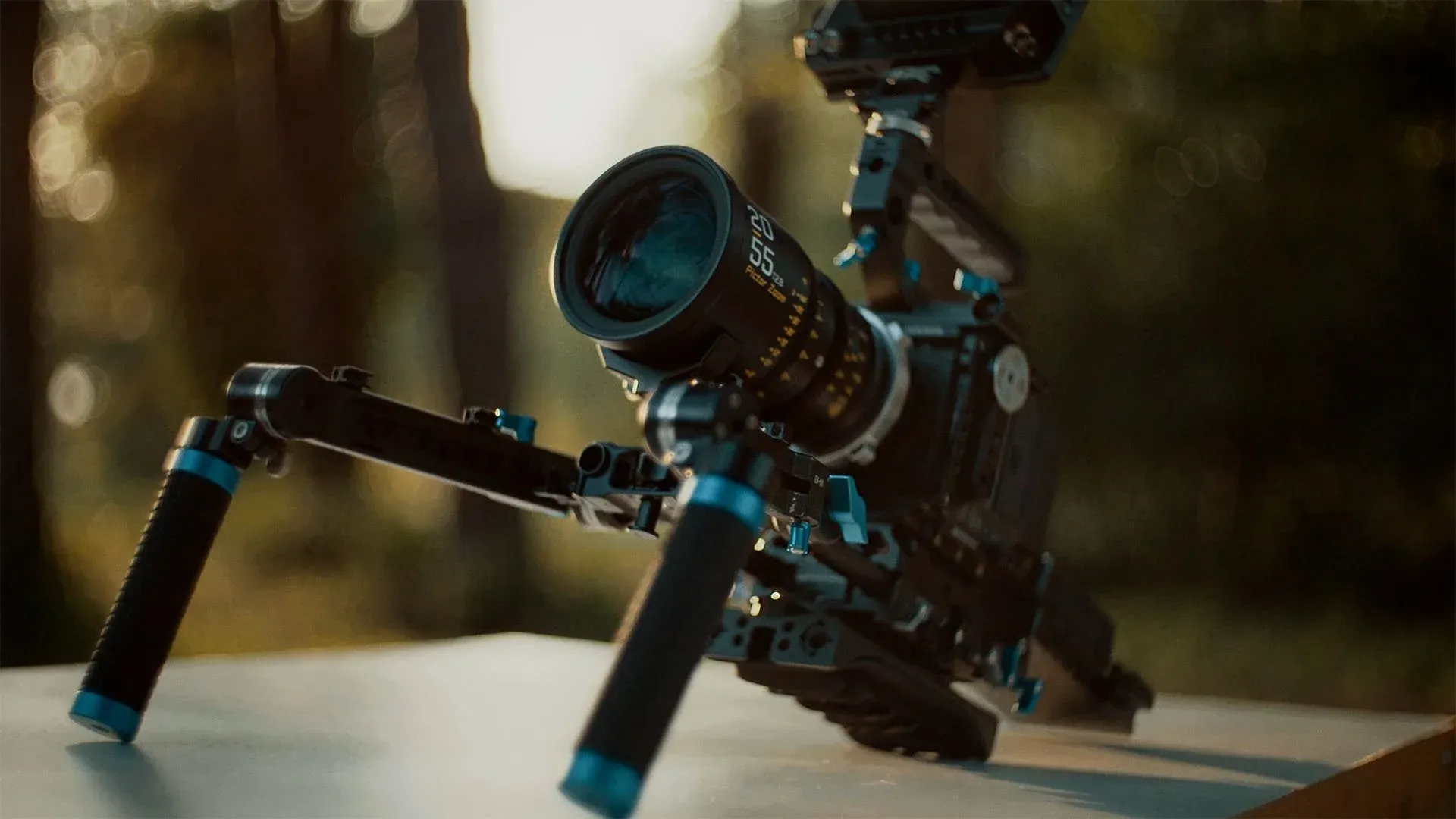 Komodo rig with shoulder pad and rods carrying a large cine zoom lens with no lens support